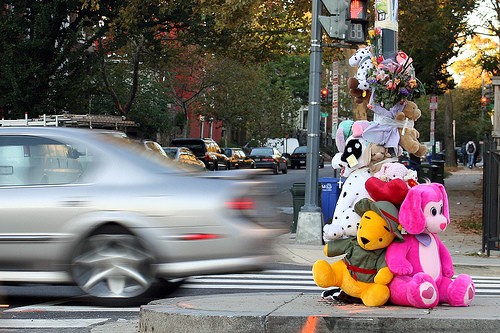 Killer drivers Road accident Memorial with colourful stuffed toys and a car