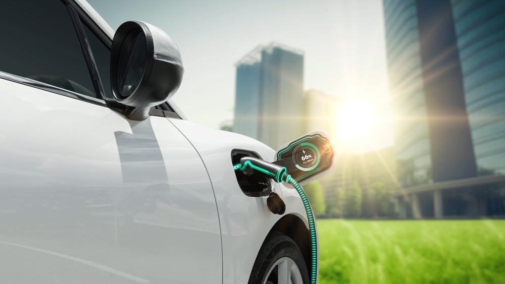 Hybrid Car Lease- White mini plugged in City Scape view
