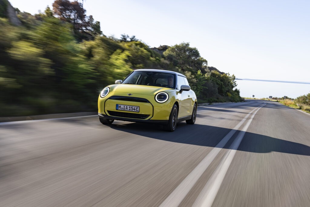 Zero Deposit Car Leasing:-New yellow Mini coming toward the camera on open road