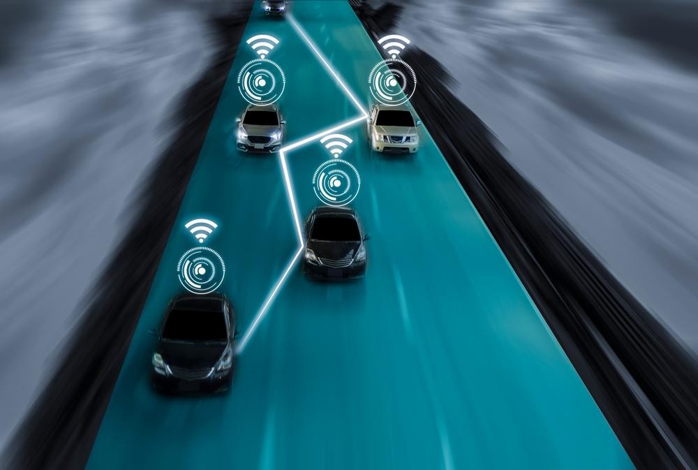 Vehicles to vehicle communication cars driving and talking to each other on a motorway