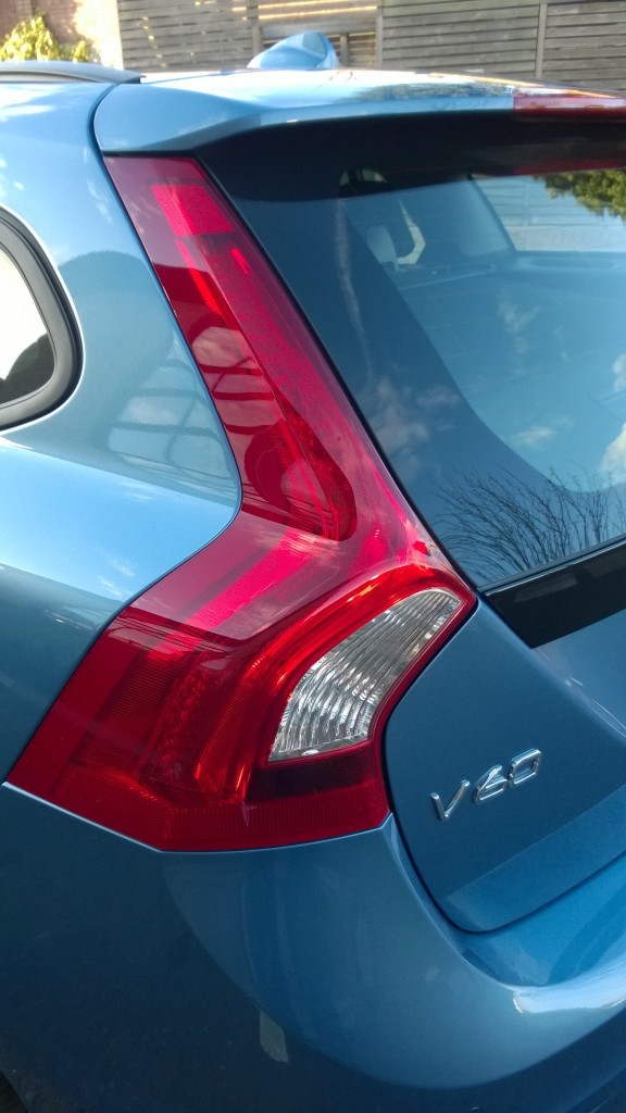 back end of silver blue executive car