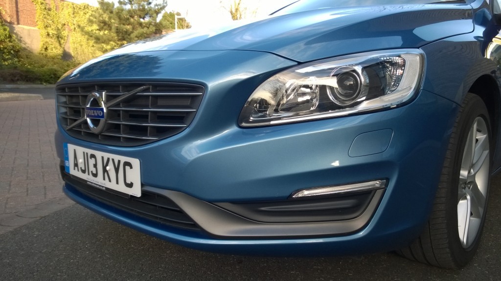 front end of silver blue executive car